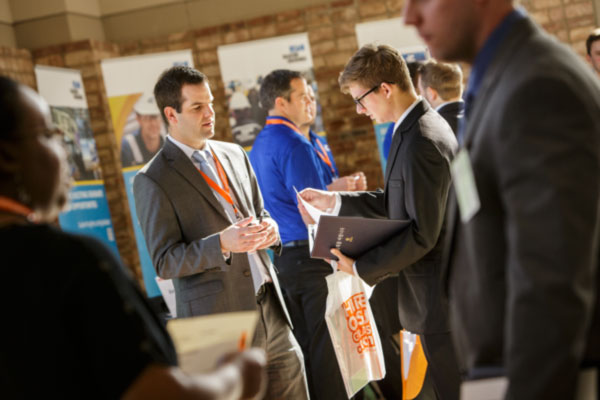 Student talking to an employer at the OSU Career Fair